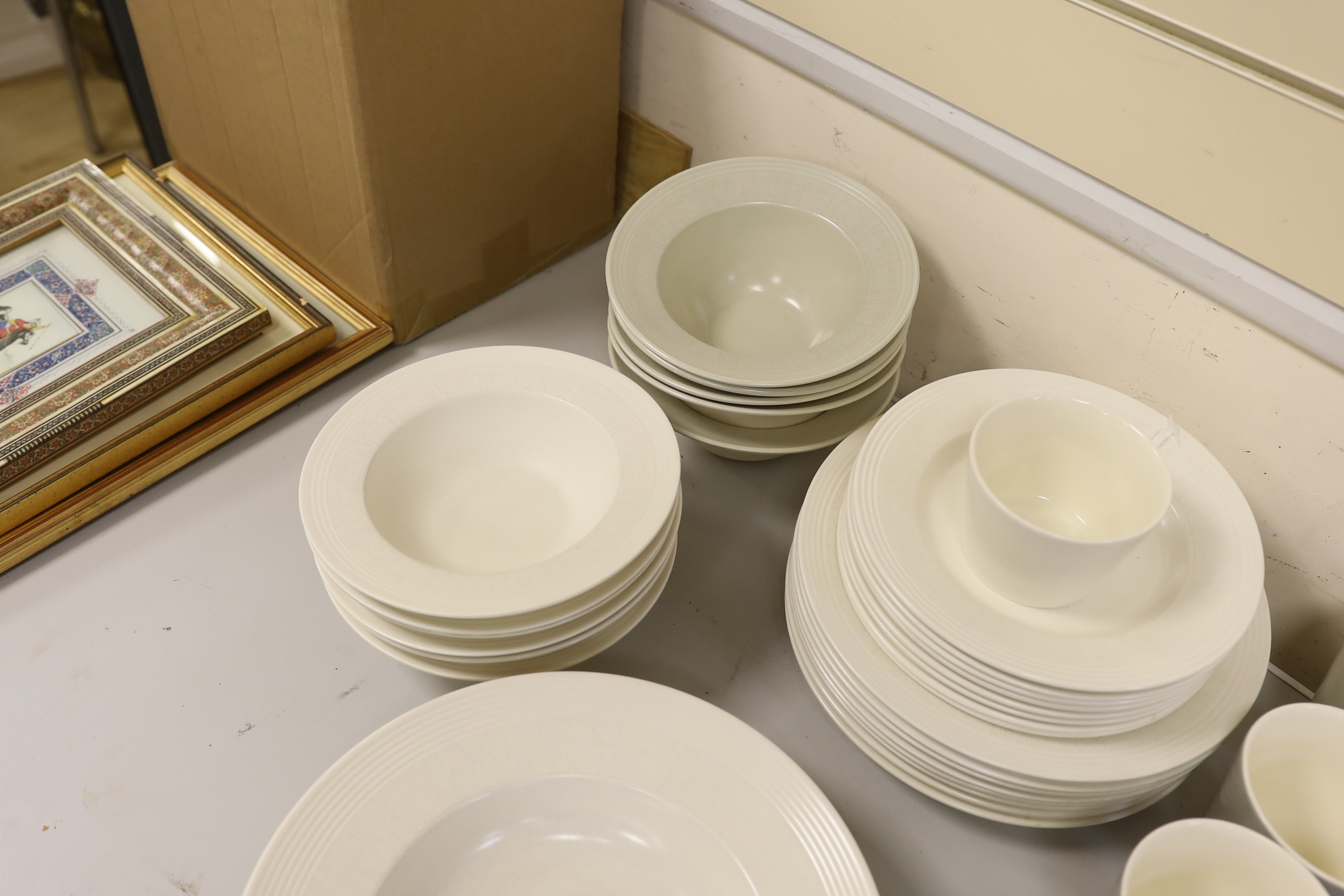Paul Costelloe for Wedgwood, a part dinner set including six mugs, six bowls and eight dinner plates